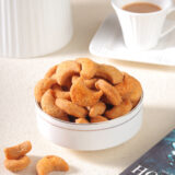 Maida Kaju is a delightful Indian snack that combines the richness of cashews with the lightness of refined flour.