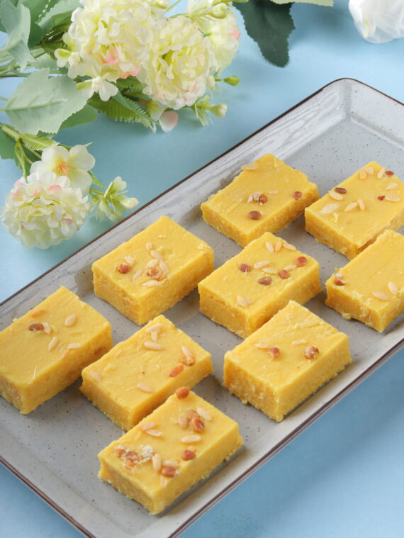 buy "Enjoy within the powerful charm of Patisa, a cherished Indian sweet known for its delicate layers of gram flour and ghee, enriched with a hint of cardamom and decorated with almonds. Each bite offers a perfect balance of sweetness and texture, making it a favorite during celebrations and special events.