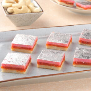 shop Triple Maza Burfi, a layered Indian sweet with three flavors.