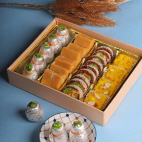 buy The Mithai Gift Box is a luxurious and traditional assortment of Indian sweets (mithai) that makes an ideal gift for a wide range of special occasions. Each box is a celebration of flavors, textures, and colors, bringing the rich heritage of Indian confectionery to life.